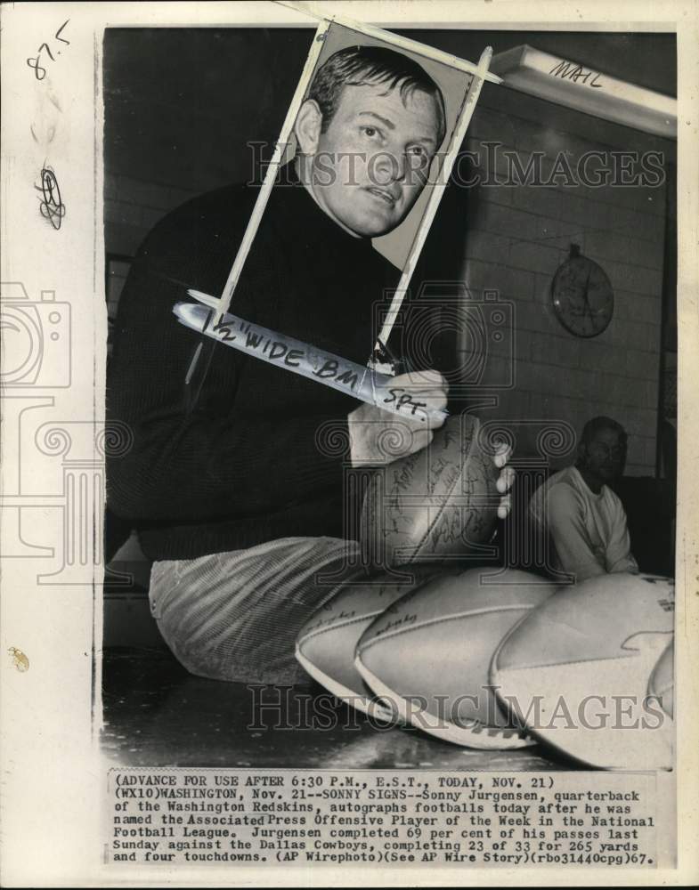 1967 Press Photo Redskins' football player Sonny Jurgensen signs footballs, WA- Historic Images