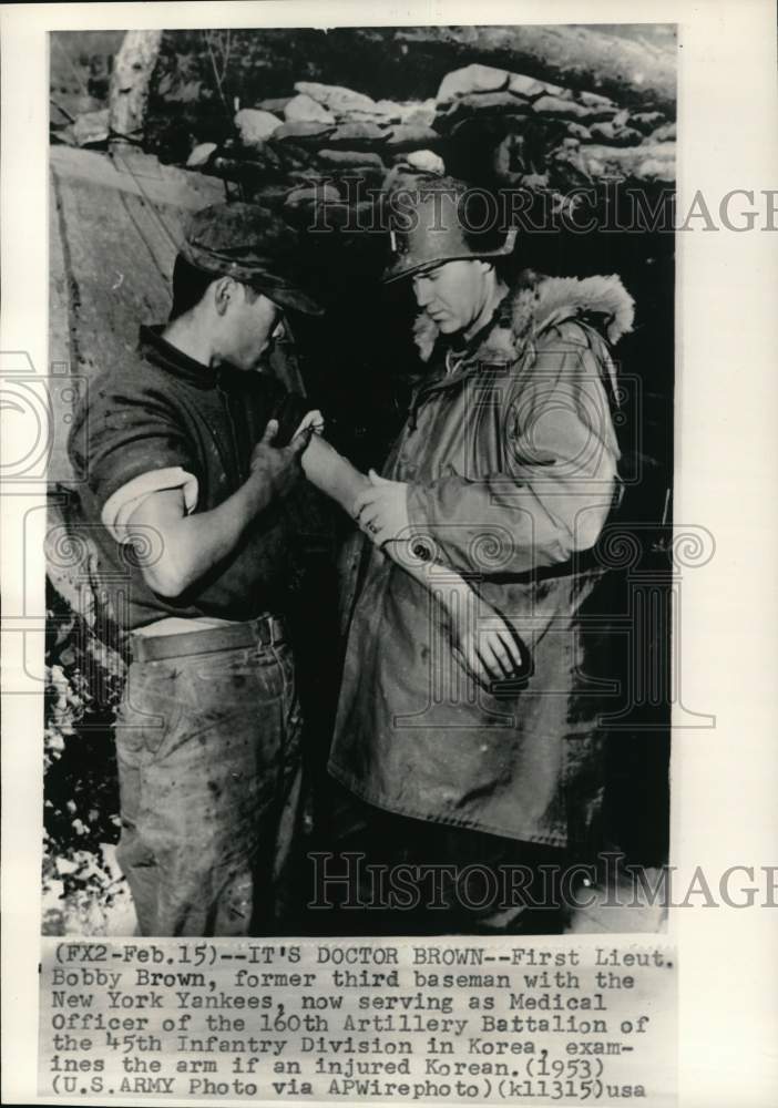 1953 Press Photo Ex-baseball player Bobby Brown examines injured Korean soldier- Historic Images