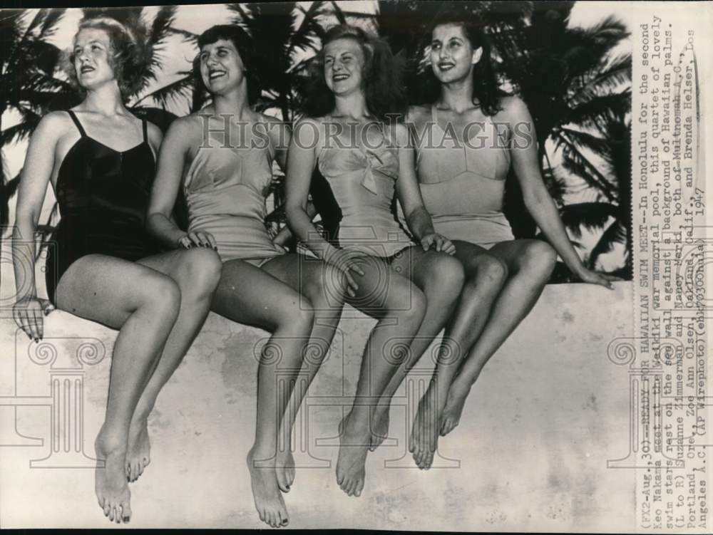 1947 Press Photo Lady Swimmers Rest On Sea Wall Before Honolulu, Hawaii Meet- Historic Images