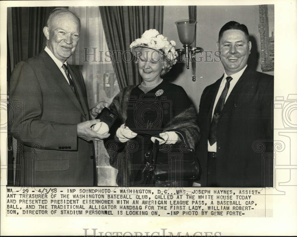 1958 Press Photo Mrs Joseph Haynes presents baseball to President Eisenhower, DC- Historic Images