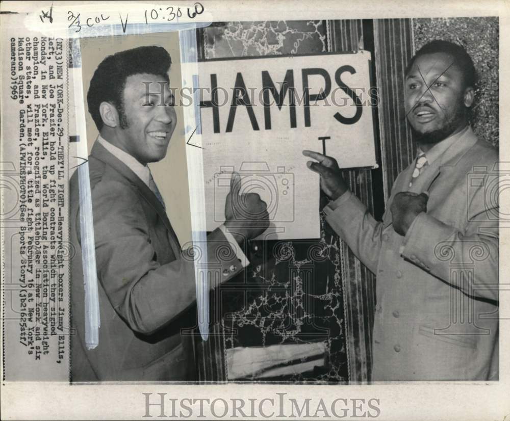 1969 Press Photo Boxers Jimmy Ellis &amp; Joe Frazier hold up fight contracts, NY- Historic Images