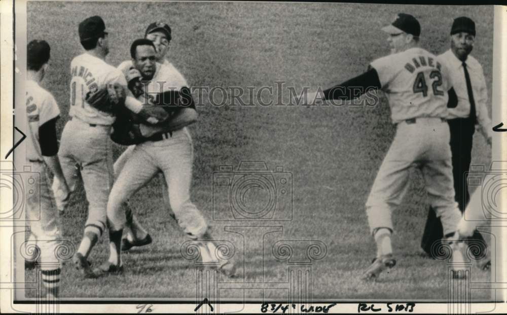 1967 Press Photo Frank Robinson restrained by teammates during baseball game- Historic Images