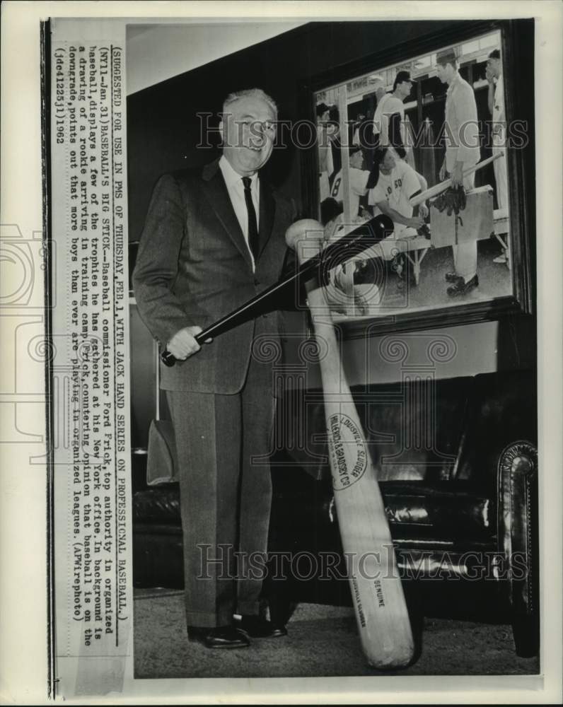 1962 Press Photo Ford Frick shows big baseball bat at his office, New York- Historic Images