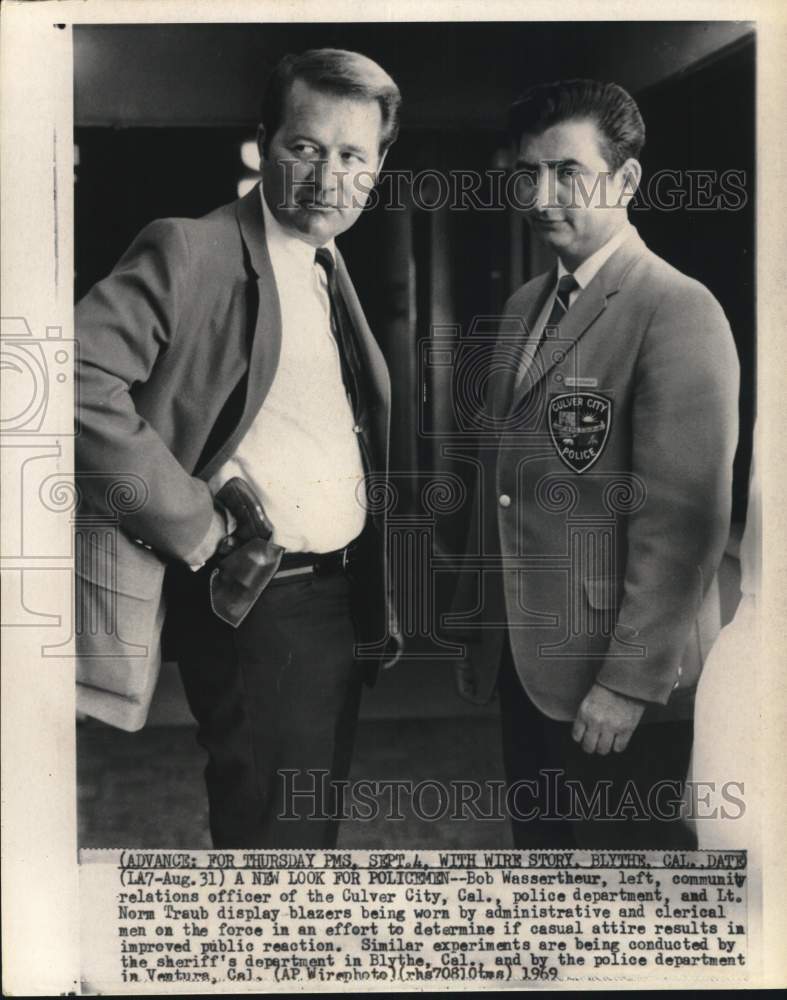 Load image into Gallery viewer, 1969 Press Photo Bob Wassertheur &amp; Norm Traub display casual uniforms in CA
