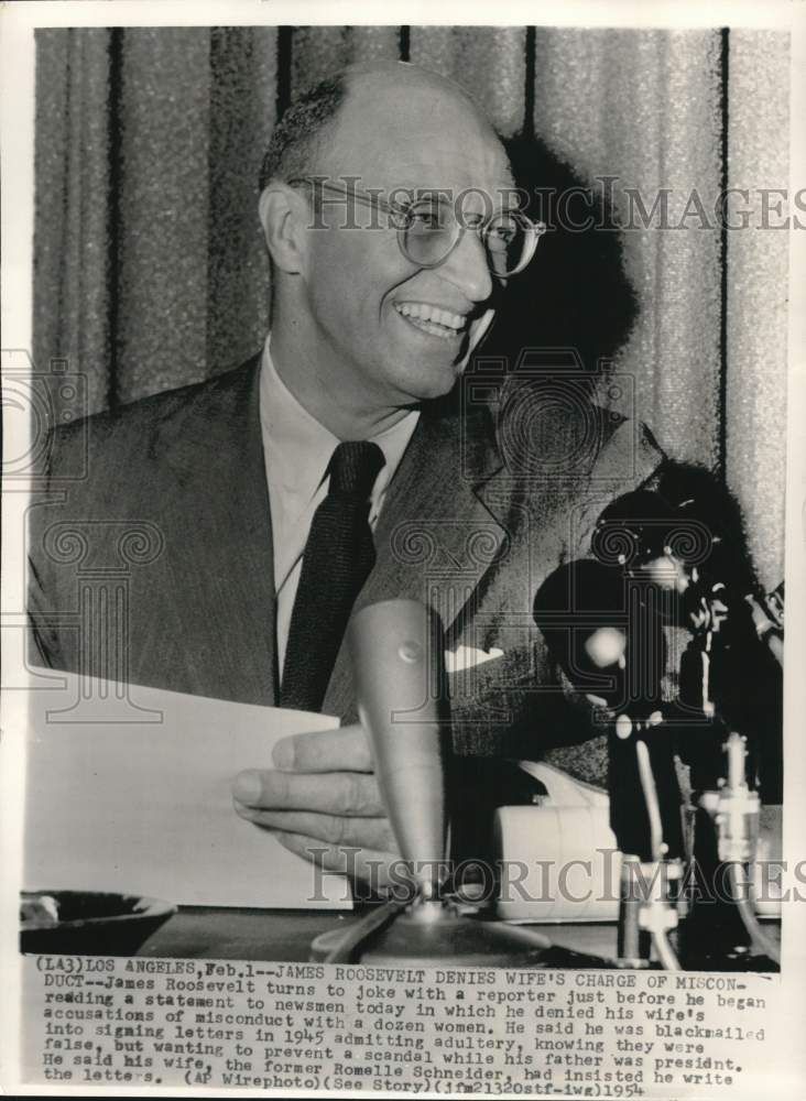 1954 Press Photo James Roosevelt denies womanizing accusations to newsmen in CA- Historic Images
