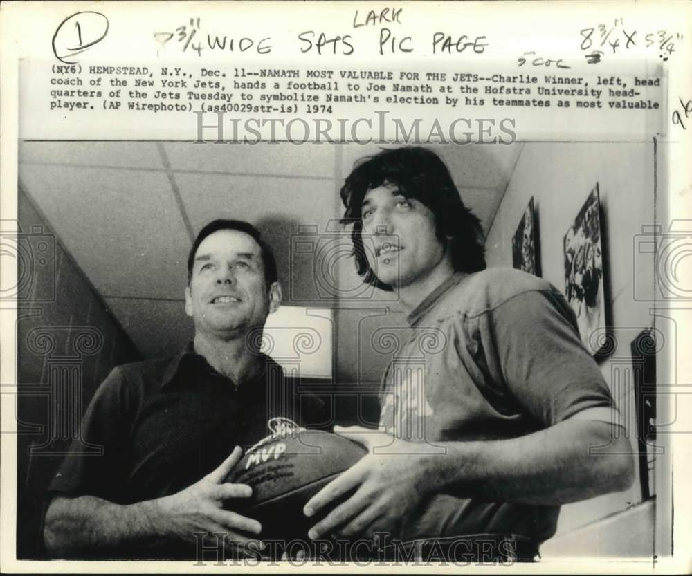 1974 Press Photo Jets Coach Winner hands football to Namath, Hofstra University- Historic Images