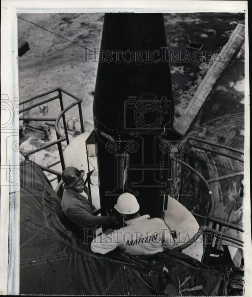 1957 Press Photo Engineers prepare the nose section of Vanguard rocket, Florida