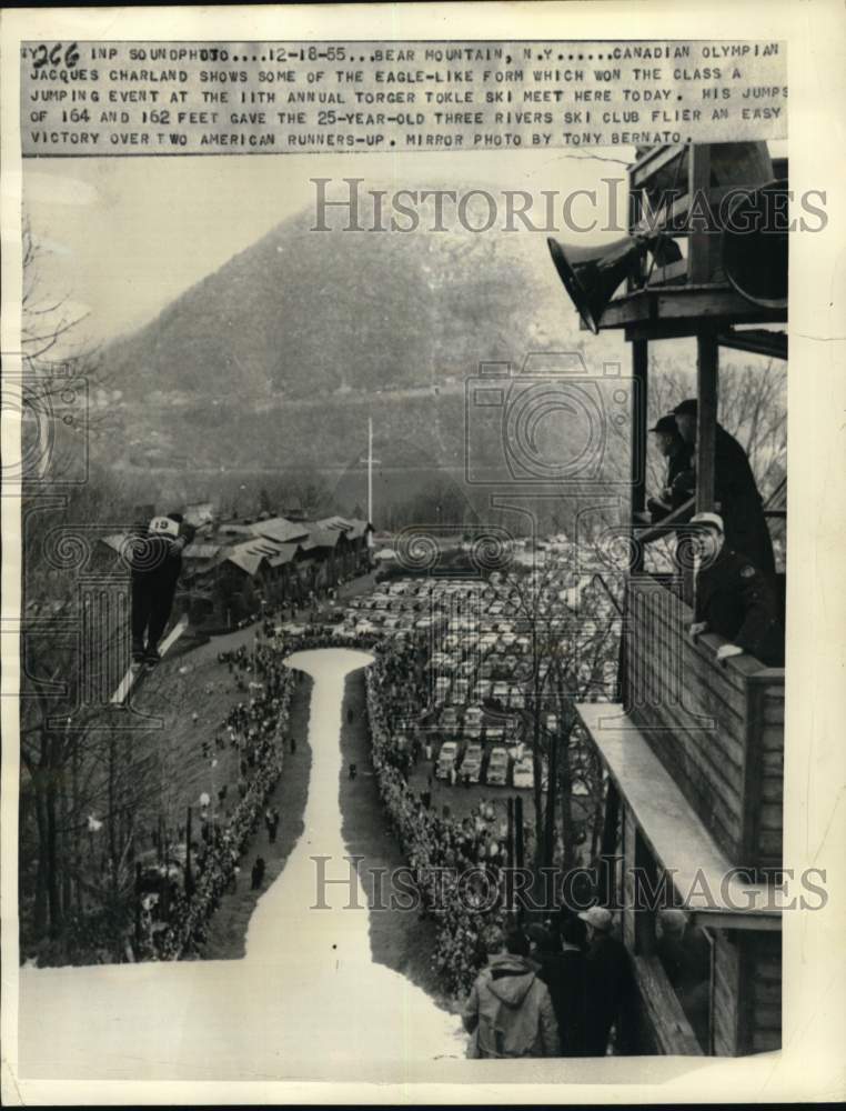 1955 Press Photo People watch Jacques Charland jump at slope, Bear Mountain, NY- Historic Images