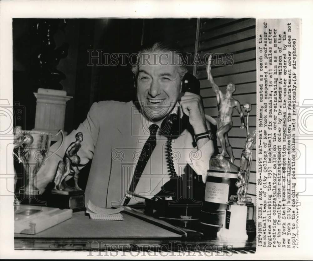 1954 Press Photo Basketball coach Nat Holman holding telephone, New York- Historic Images