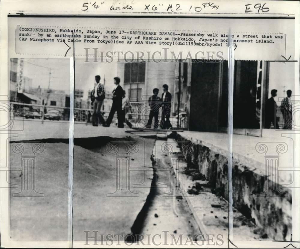 1973 Press Photo Citizens pass cracked street after earthquake in Kushiro, Japan- Historic Images