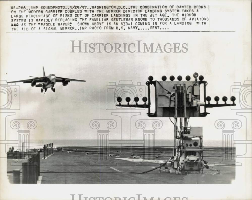 1957 Press Photo A3D-1 lands to aircraft carrier with the aid of signal mirror- Historic Images
