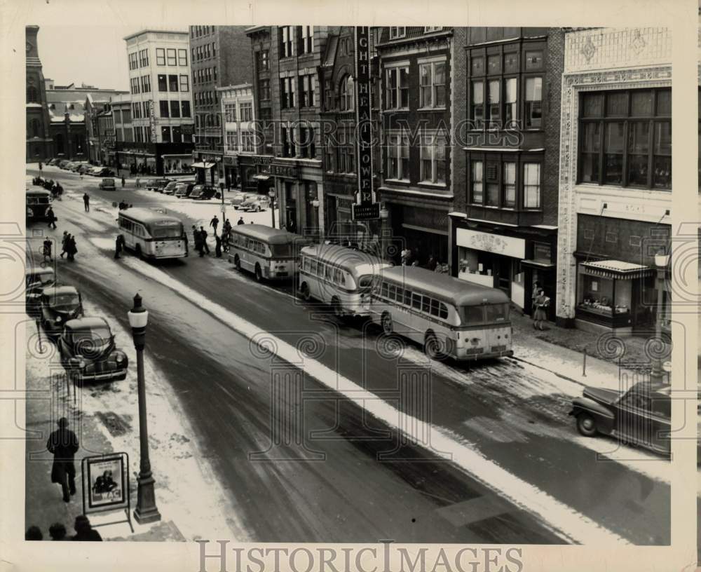 Press Photo Buses on Snow Covered Street in Downtown Harrisburg, Pennsylvania- Historic Images