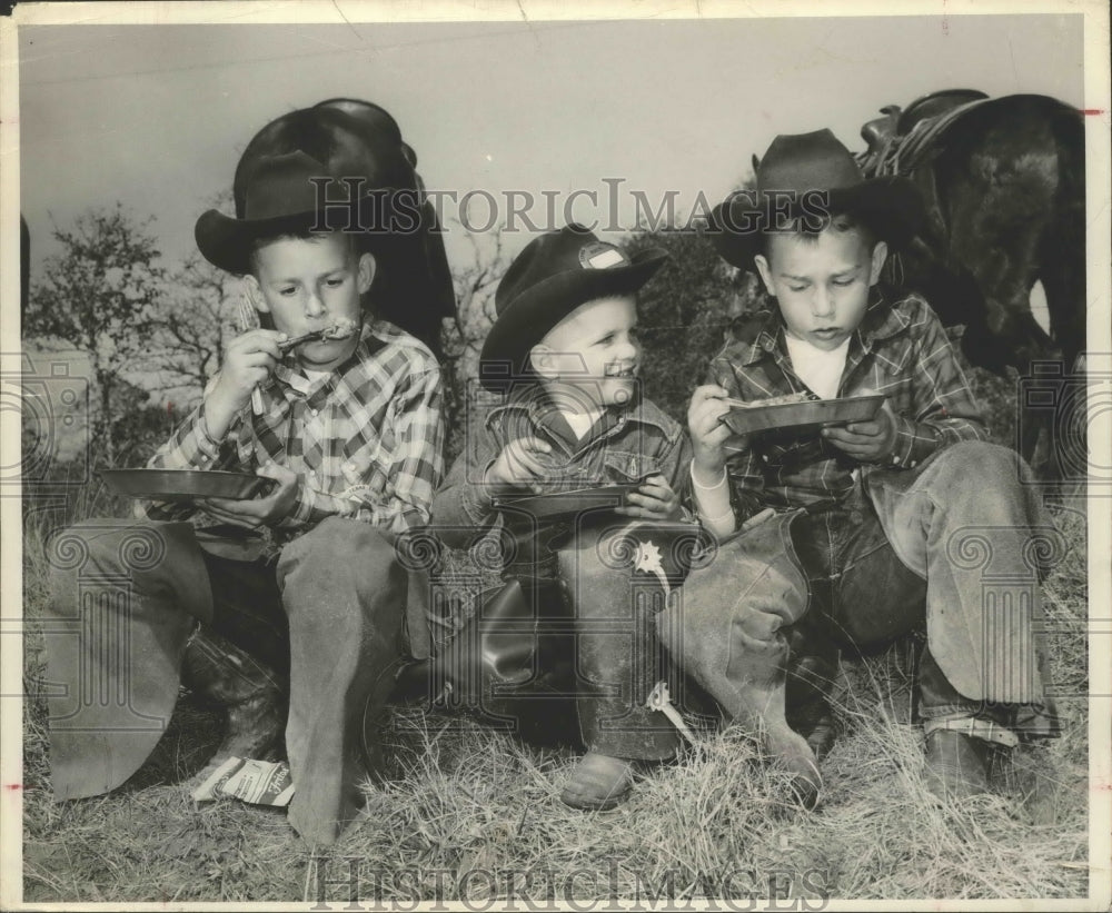 1958 Press Photo Three young cowpokes sharing a meal, San Antonio - saa00102- Historic Images