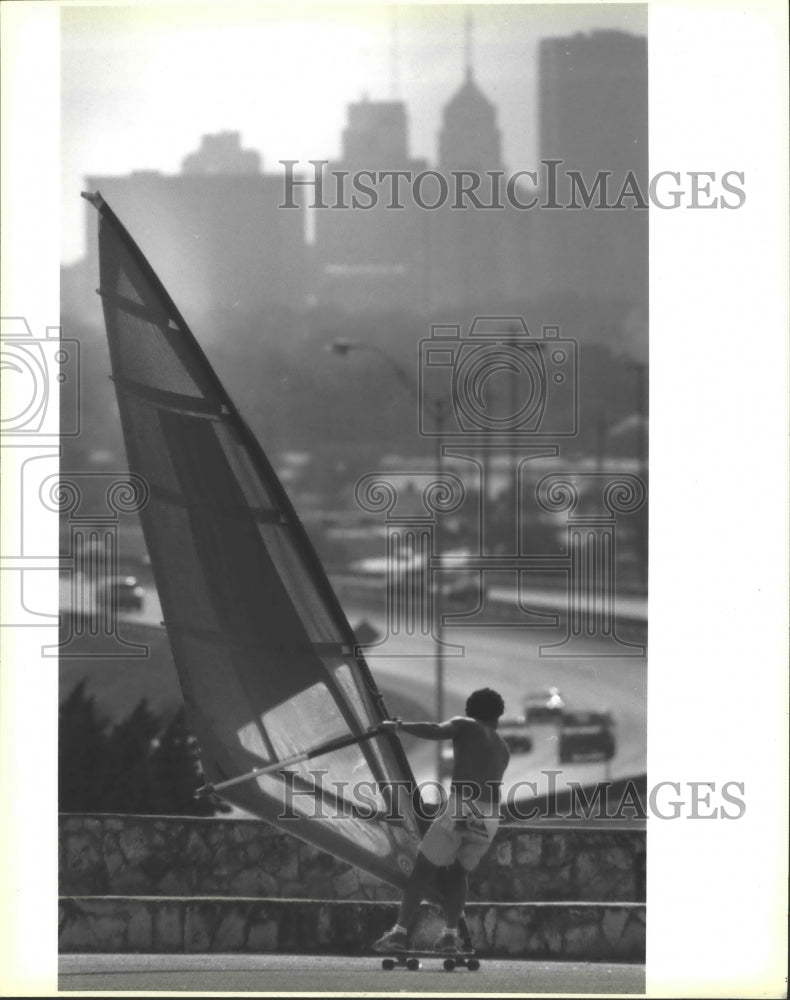 1990 Press Photo Roland Benavides enjoys &quot;Sail Skating&quot; at Alamo Stadium- Historic Images