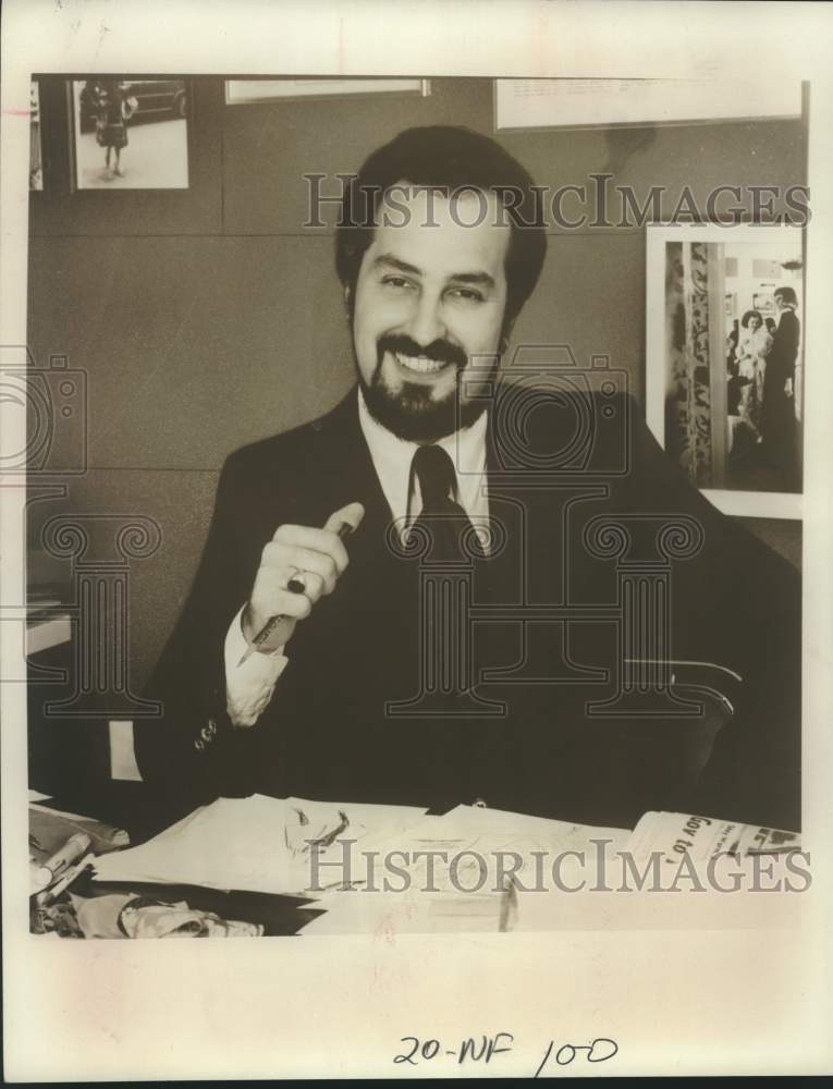 Press Photo Albert Caprero, Fashion Designer sits at desk - saa07271