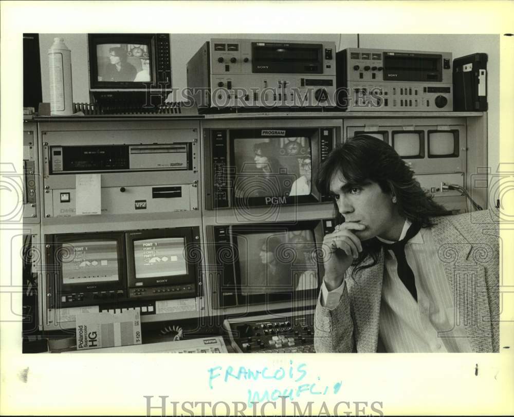 1988 Press Photo Francois Mouflia sits in front of Cable Access Channel monitors- Historic Images