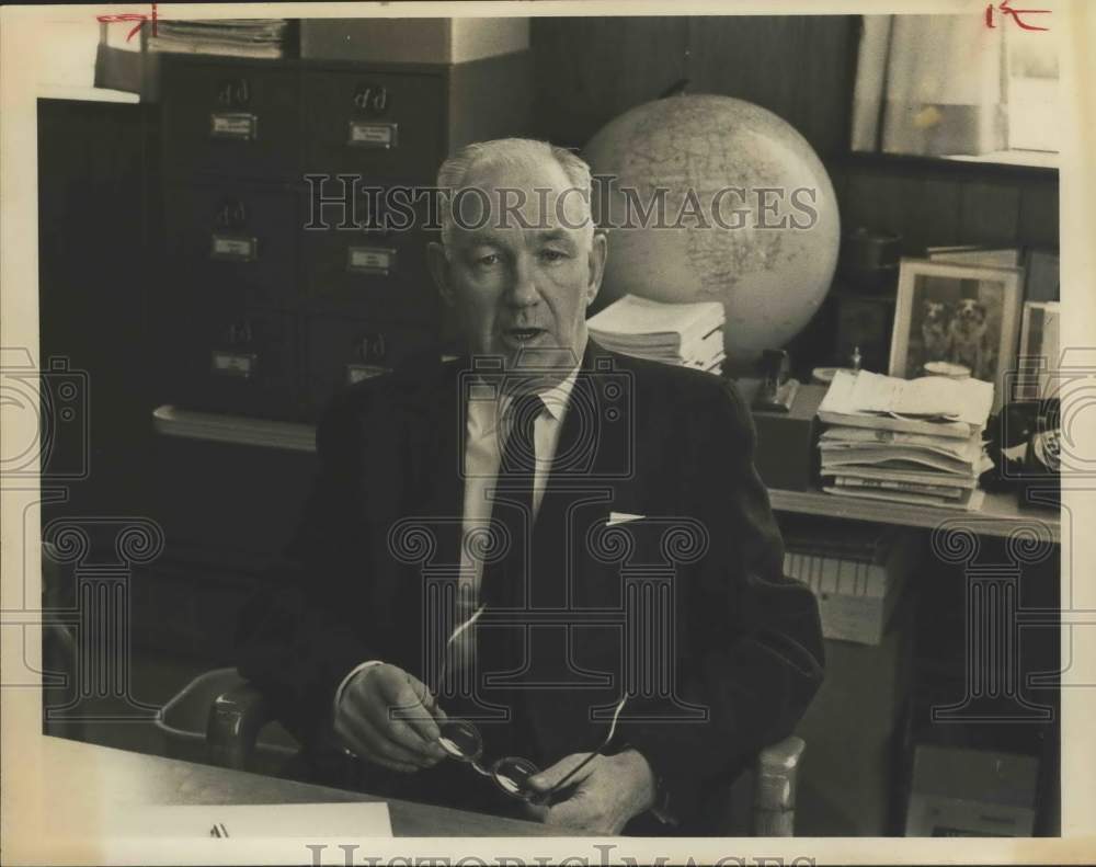 1954 Press Photo Robert Walsh sitting at his desk - saa24066