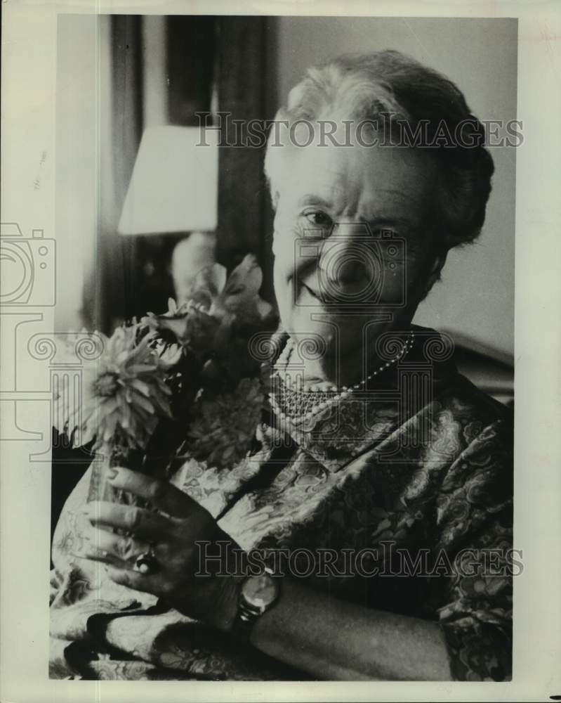 1974 Press Photo Madame Louise Weiss holding vase of flowers - saa30325