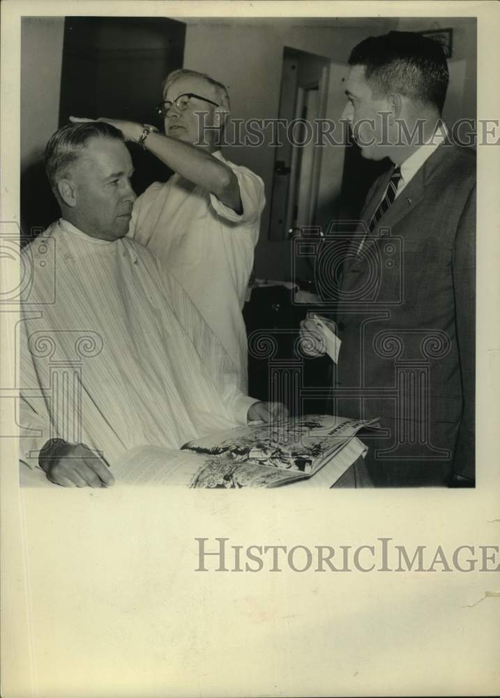 Press Photo Joe Stedham Jr., getting haircut with Tom Dew and John Goode