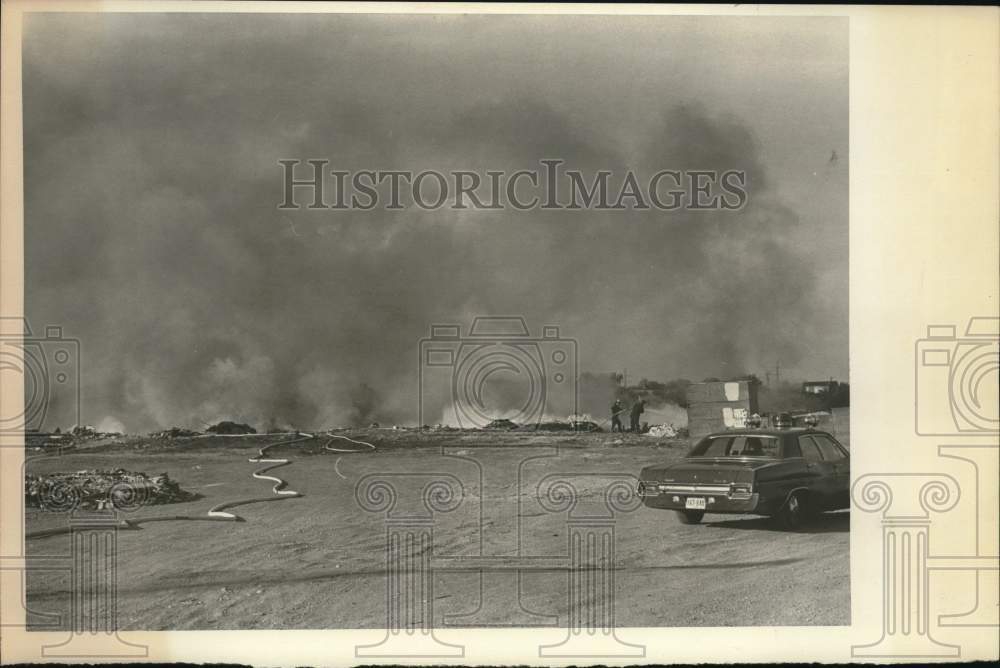 1972 Press Photo Firefighters on scene of junkyard fire - saa64684