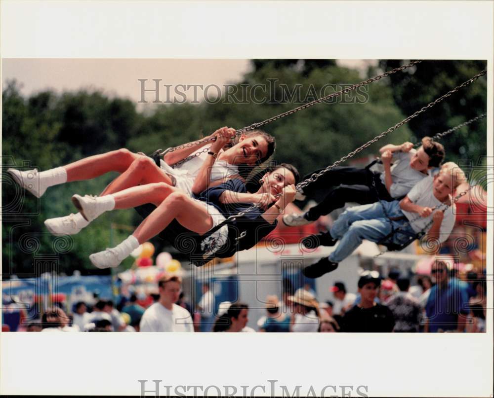 1993 Press Photo Riders on Swing Ride at St.Luke's Catholic Church Fiesta- Historic Images
