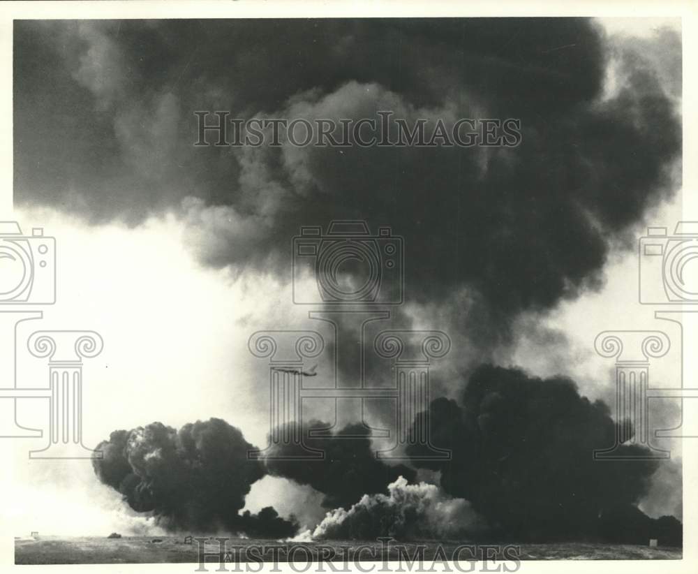 Press Photo Airplane Flying Through Black Smoke Over Field - sam05006- Historic Images