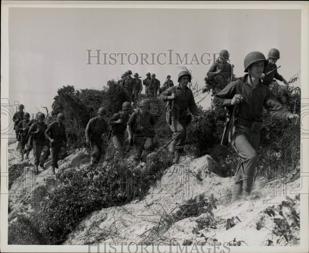 Press Photo Military personnel moving over sand dunes - sam06732- Historic Images