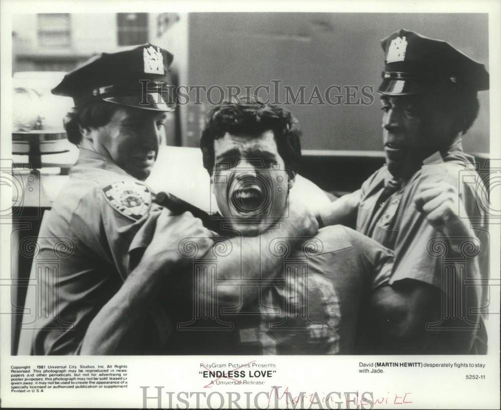 1981 Press Photo Actor Martin Hewitt restrained by co-stars in "Endless Love"- Historic Images