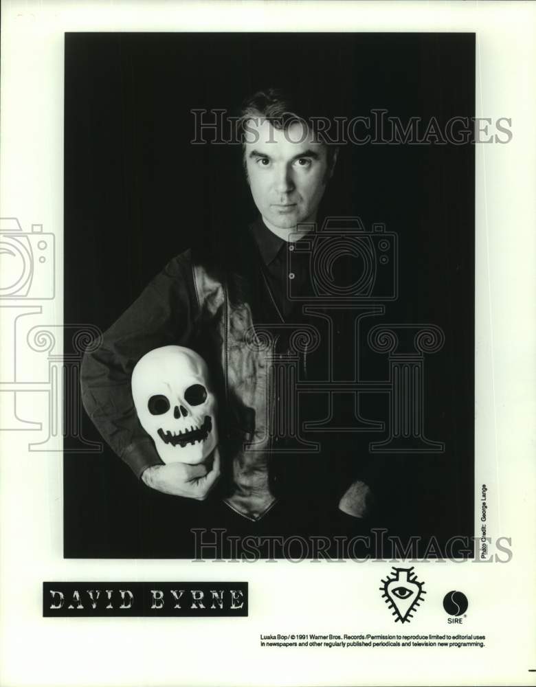 1991 Press Photo David Byrne, Musician in portrait with skull mask - sap09279- Historic Images