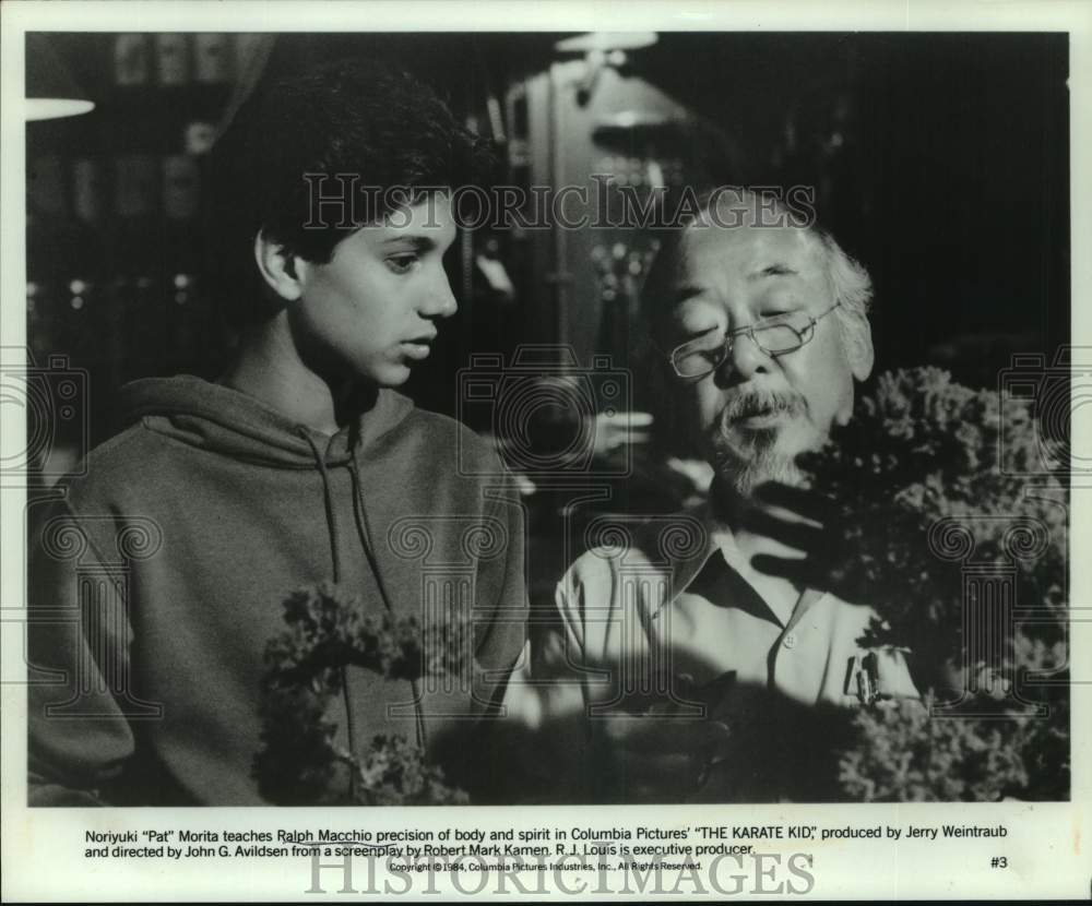 1984 Press Photo Pat Morita and Ralph Macchio in a scene from The Karate Kid.- Historic Images