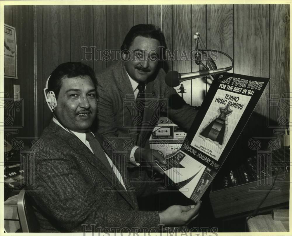 1985 Press Photo Tejano Music Awards Contest Poster held by men at Radio Station- Historic Images