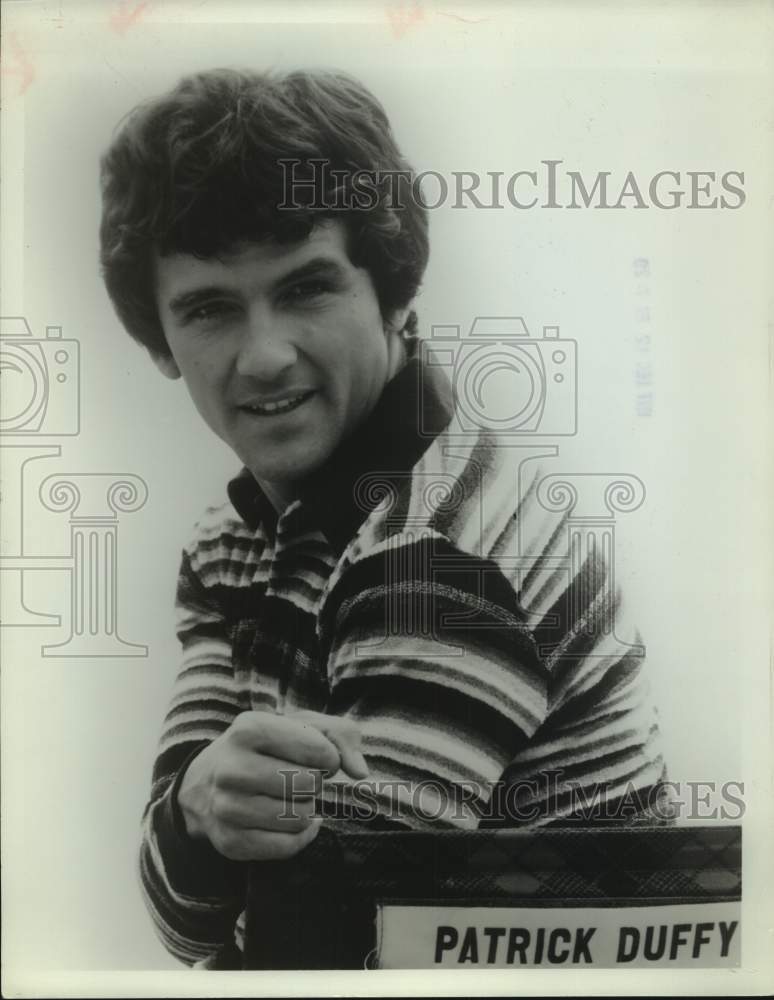 1977 Press Photo Patrick Duffy, actor seated in chair on set - sap13379- Historic Images