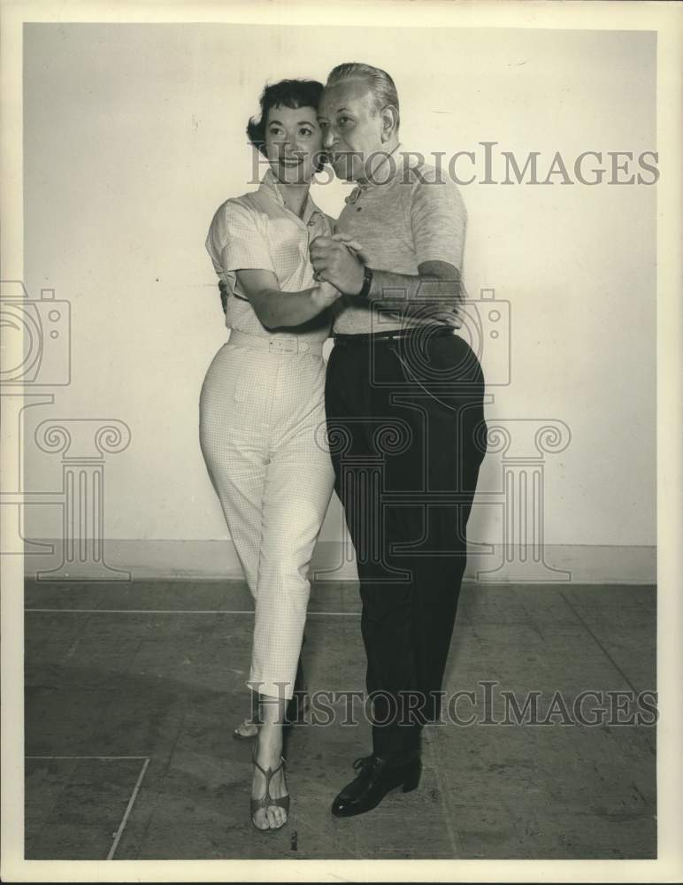 1957 Press Photo Singer Gisele MacKenzie dances with man in portrait - sap16581