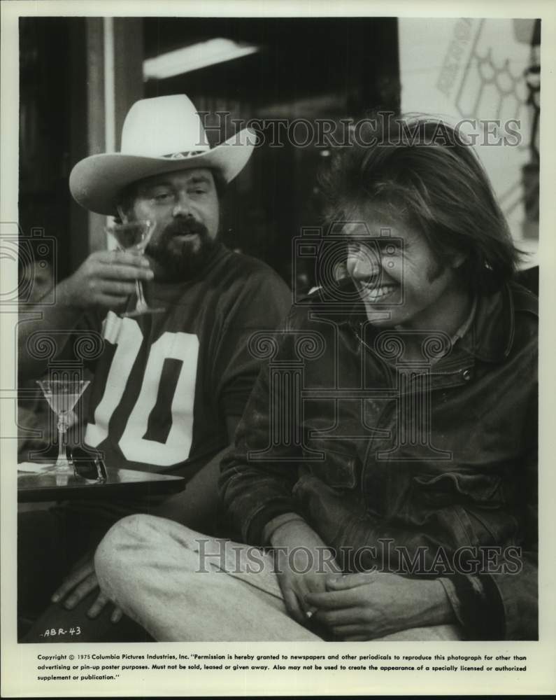 1975 Press Photo Actor cheers co-star in show scene - sap22171- Historic Images