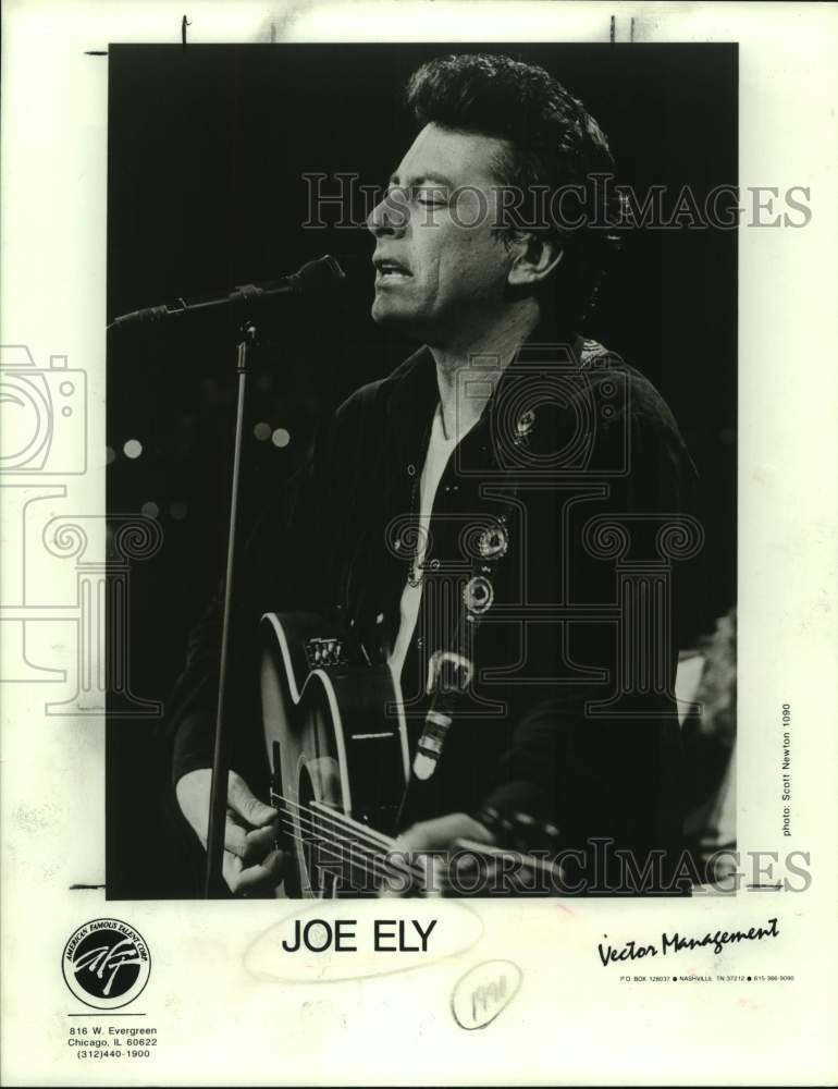 1990 Press Photo Joe Ely, Singer in concert playing guitar - sap22346- Historic Images