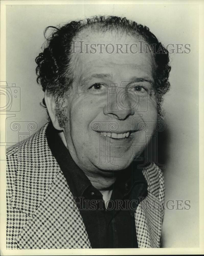 Press Photo Bald Man in Checked Jacket - sap52650- Historic Images