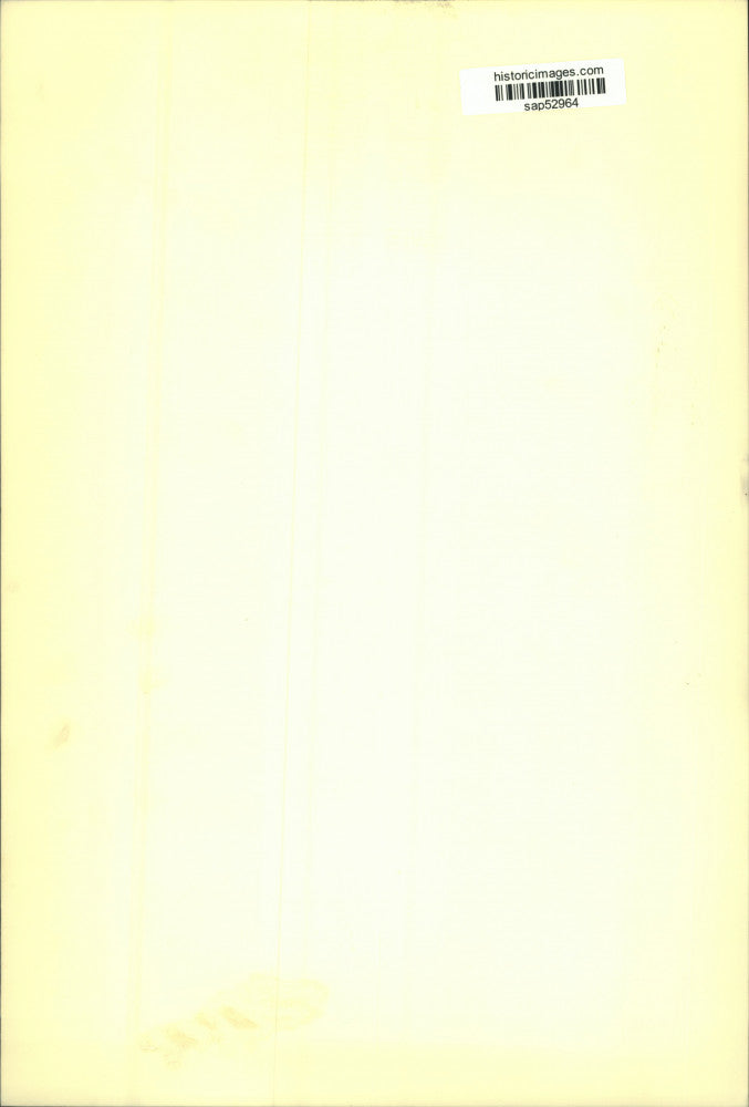 Press Photo Elderly Woman Holds Scrapbook With Photo of Younger Self - sap52964