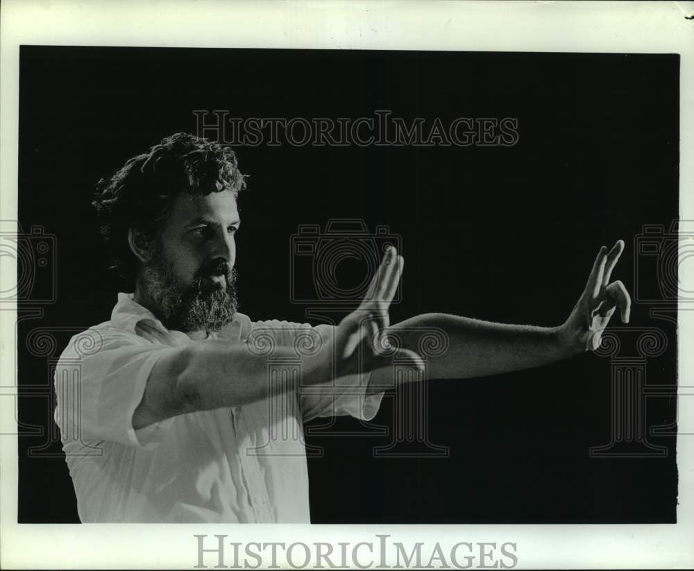 Press Photo Man Holds Out Arms - sap53357- Historic Images