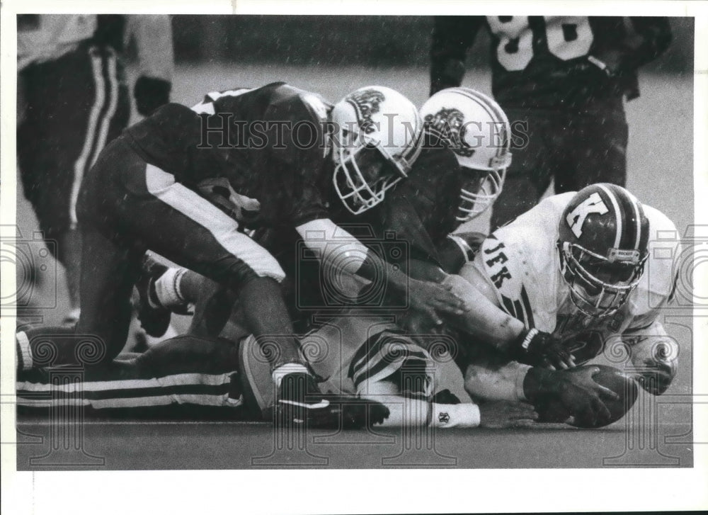 1991 Press Photo Burbank and JFK pursue a fumbled football at Alamo Stadium- Historic Images