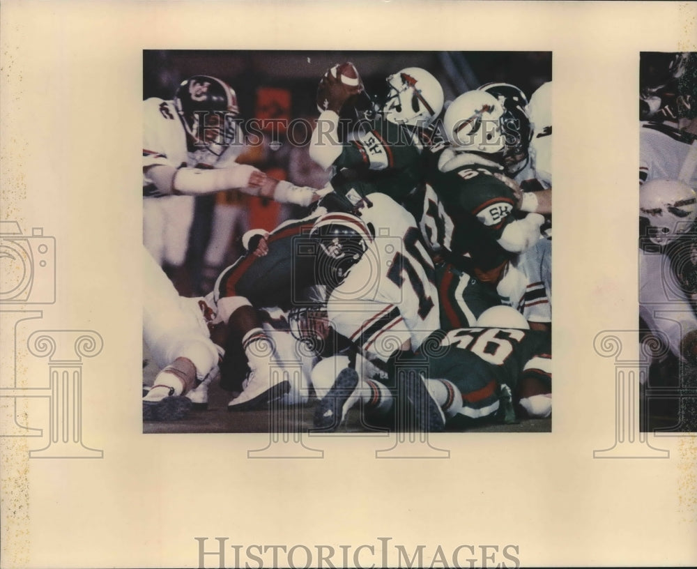 1988 Press Photo Michael Winn of Sam Houston is wrapped up by Andy Price- Historic Images