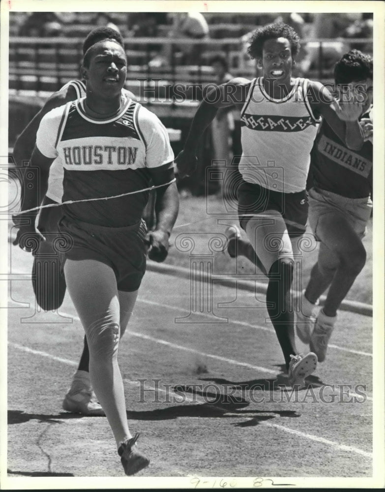 1984 Press Photo Michael Hughes of Sam Houston High track team wins the 100- Historic Images