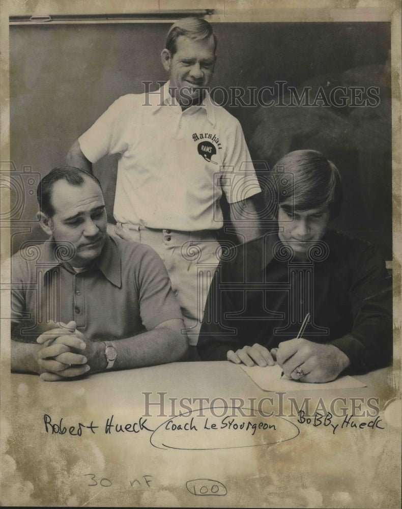 Press Photo Marshall High football player Bobby Hueck signs his college intent- Historic Images