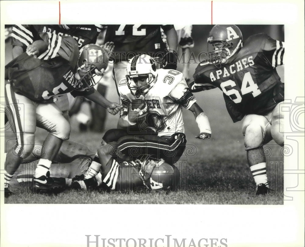 1992 Press Photo Escamilla gets tackled by Lynd, Antonian High School Stadium- Historic Images