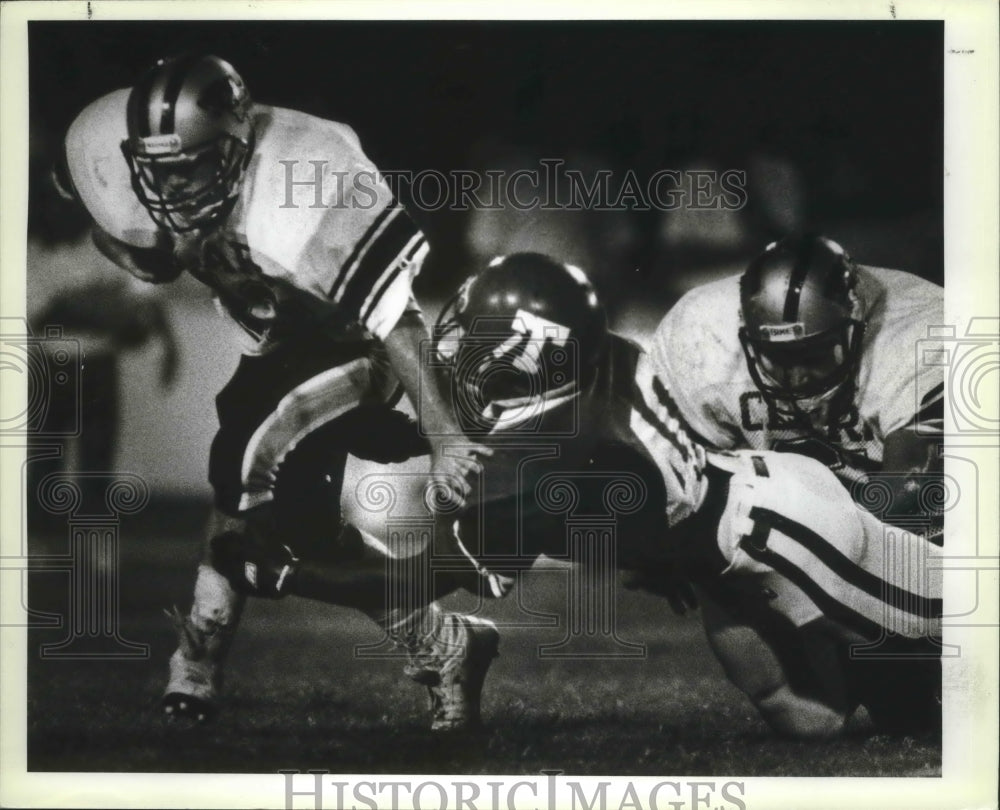 1988 Press Photo Clark and Taft High School Football Players at Game Tackle- Historic Images