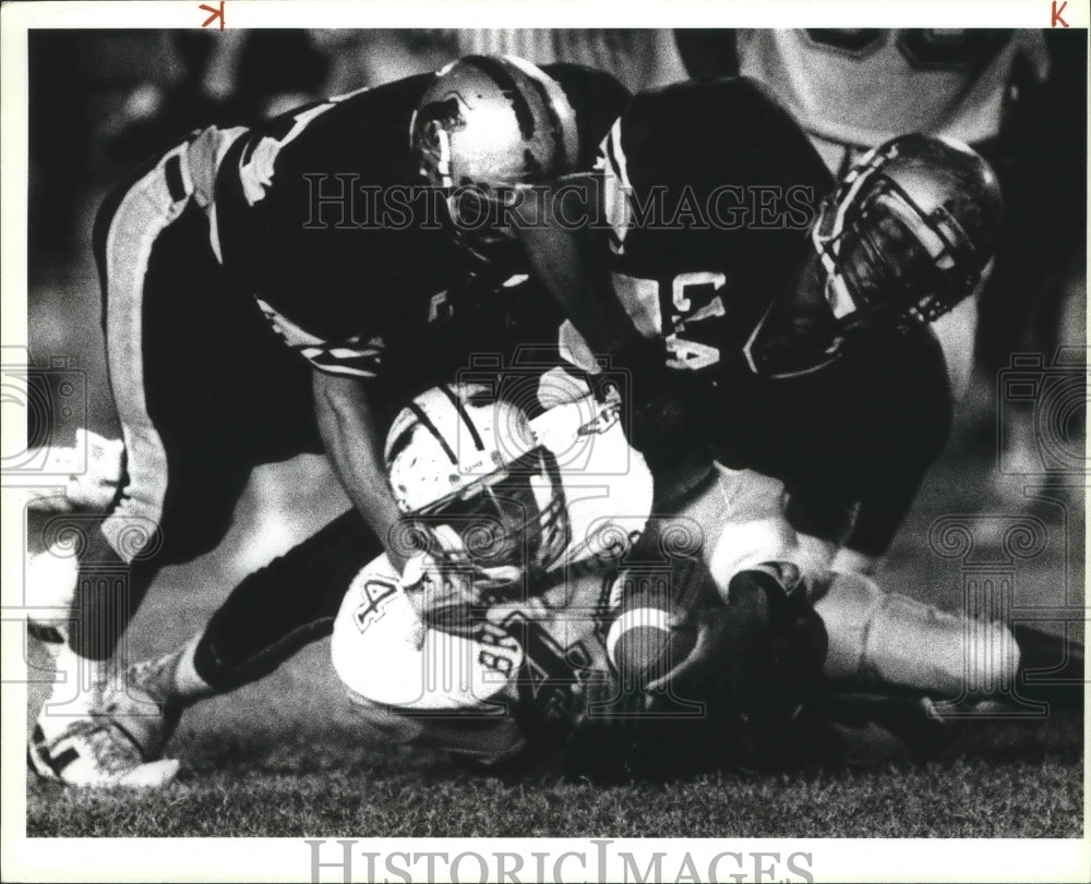 1990 Press Photo Brackenridge Versus Clark High School Football Game Tackle- Historic Images