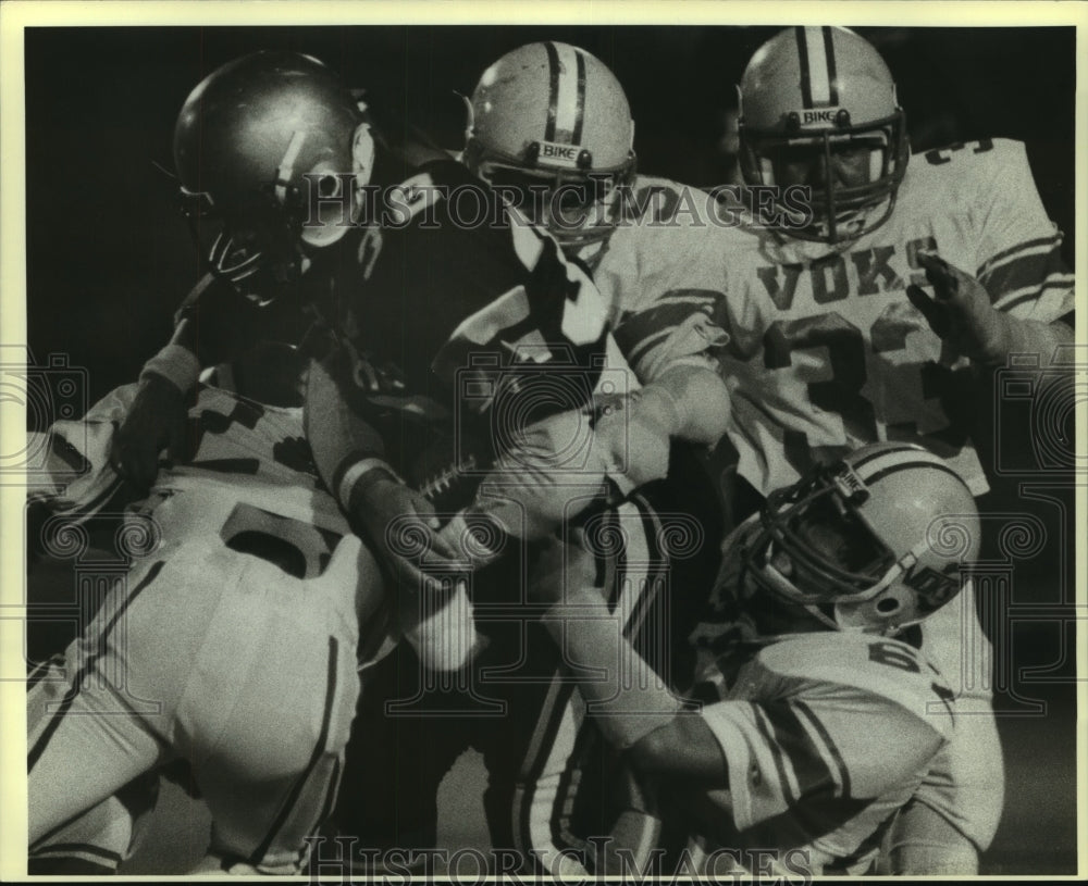 1983 Press Photo Carlos Vargas, Football Player Tackled at Lanier Game- Historic Images