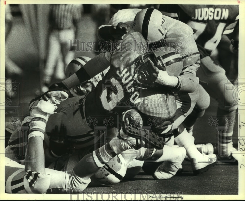1983 Press Photo Judson and Yates High School Football Players at Game Tackle- Historic Images