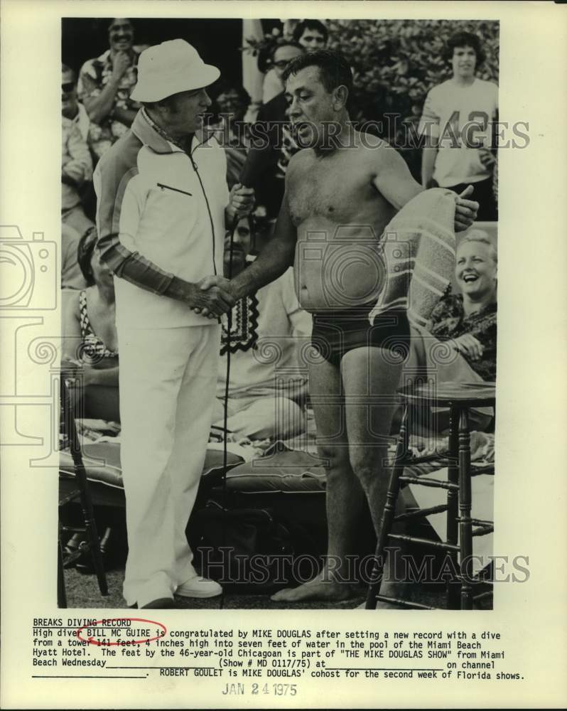 1975 Press Photo High diver Bill McGuire with TV host Mike Douglas - sas14157- Historic Images