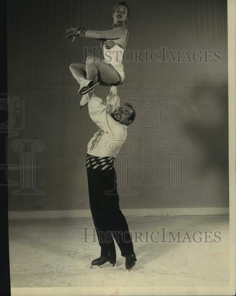 1957 Press Photo A pair of figure skaters strike a pose - sas15434- Historic Images