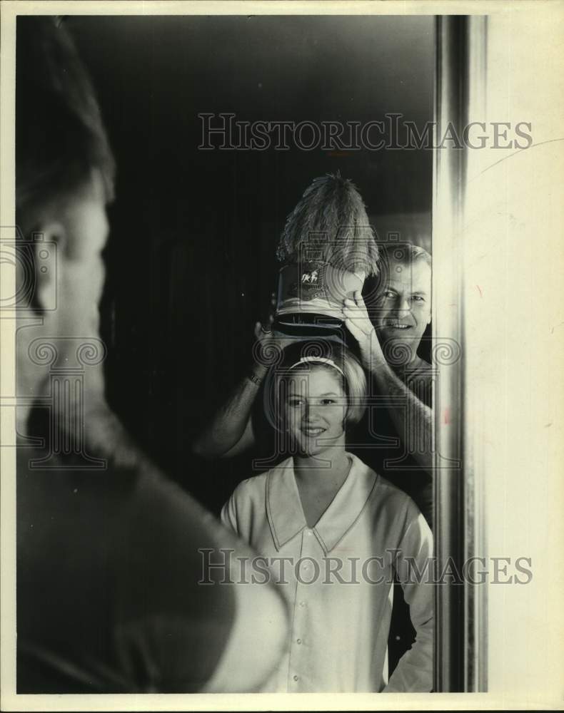 1965 Press Photo Walter Corrigan, mirror and hat and girl - sas18568- Historic Images